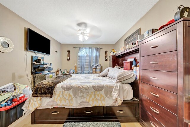 1505 E 99th Ave, Tampa, FL 33612 - bedroom featuring wood finished floors, a ceiling fan, and a textured ceiling