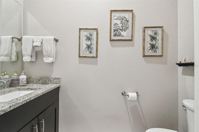 half bath with toilet and vanity