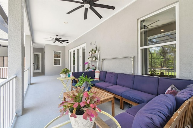 living room featuring ceiling fan, french doors, and a textured wall