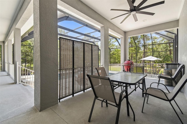 sunroom / solarium with ceiling fan and healthy amount of natural light