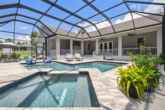 view of pool featuring a ceiling fan, a patio area, and a pool with connected hot tub
