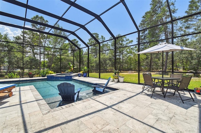 view of swimming pool with a patio area, a pool with connected hot tub, a lanai, and outdoor dining area
