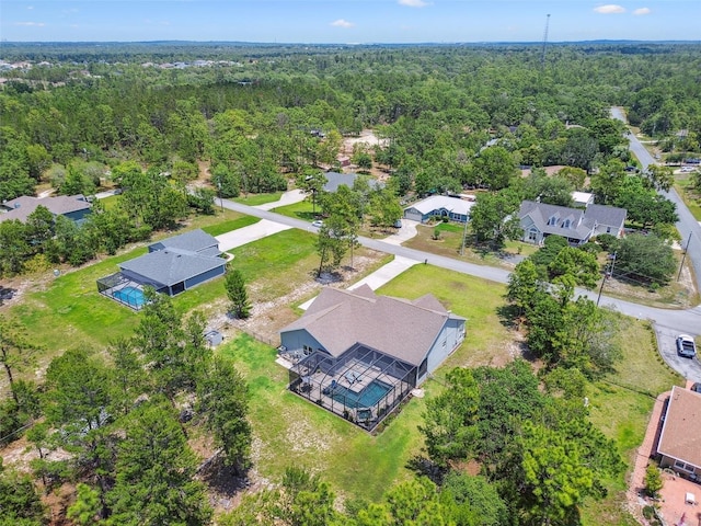 drone / aerial view of a heavily wooded area