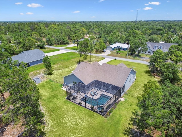 view of subject property featuring a forest