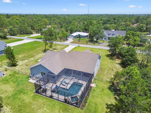 view from above of property featuring a heavily wooded area