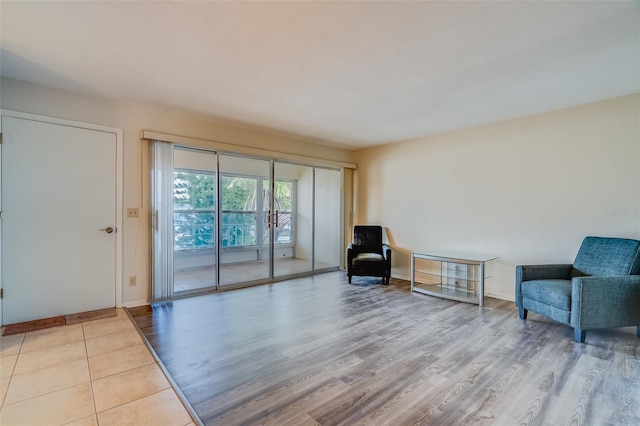 1221 Drew St Unit E12, Clearwater, FL 33755 - living area featuring wood finished floors and baseboards