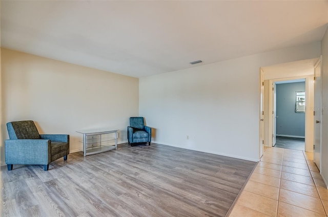 1221 Drew St Unit E12, Clearwater, FL 33755 - unfurnished room featuring light wood-style flooring and baseboards