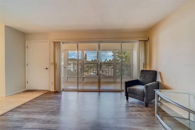 1221 Drew St Unit E12, Clearwater, FL 33755 - sitting room featuring wood finished floors and baseboards