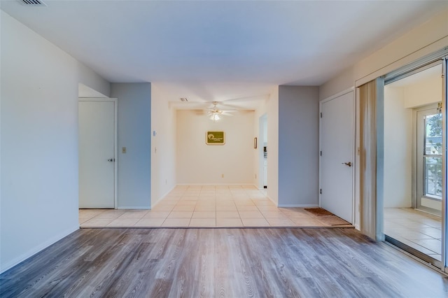 1221 Drew St Unit E12, Clearwater, FL 33755 - corridor with wood finished floors and baseboards