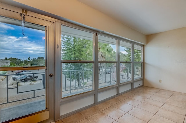1221 Drew St Unit E12, Clearwater, FL 33755 - doorway with light tile patterned flooring