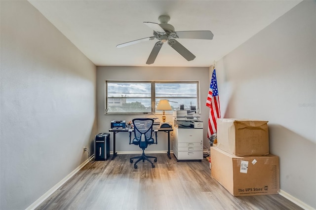 1221 Drew St Unit E12, Clearwater, FL 33755 - home office with wood finished floors, a ceiling fan, and baseboards