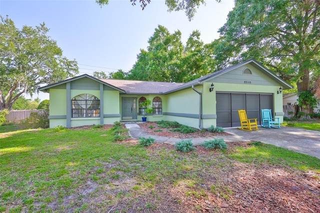 22115 Laver Ln, Land O Lakes, FL 34639 - ranch-style home featuring an attached garage, driveway, and stucco siding