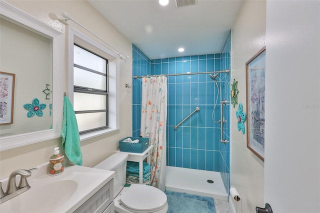 22115 Laver Ln, Land O Lakes, FL 34639 - full bathroom featuring tiled shower, toilet, and vanity