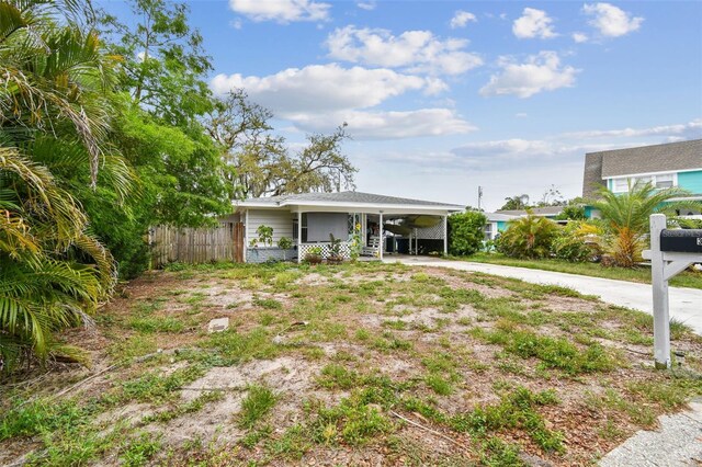 361 Colonial Ct, Dunedin, FL 34698 - view of front of home with a carport and driveway