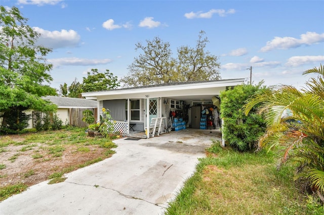 361 Colonial Ct, Dunedin, FL 34698 - view of front of property with driveway and an attached carport