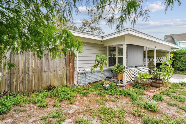 361 Colonial Ct, Dunedin, FL 34698 - view of front of home featuring a porch