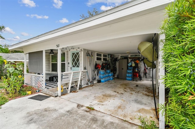 361 Colonial Ct, Dunedin, FL 34698 - property entrance with a carport and ceiling fan