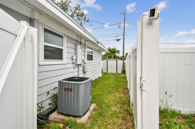 361 Colonial Ct, Dunedin, FL 34698 - view of yard featuring central AC