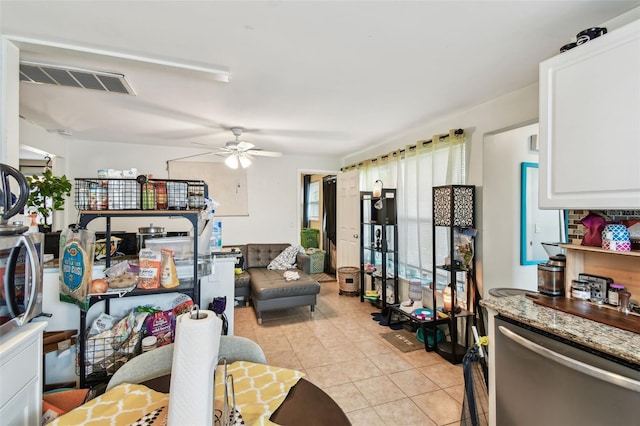 361 Colonial Ct, Dunedin, FL 34698 - living area featuring light tile patterned floors and a ceiling fan