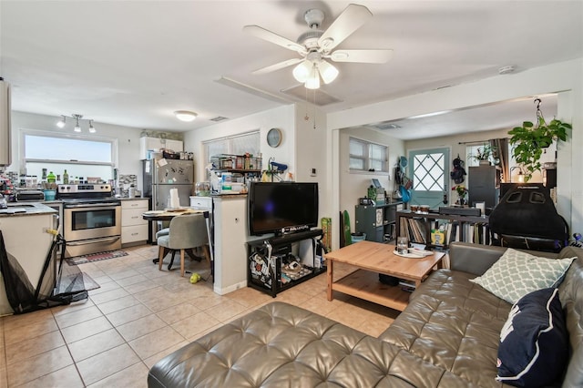 361 Colonial Ct, Dunedin, FL 34698 - living room with light tile patterned floors and ceiling fan