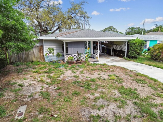 361 Colonial Ct, Dunedin, FL 34698 - view of front facade with an attached carport and concrete driveway