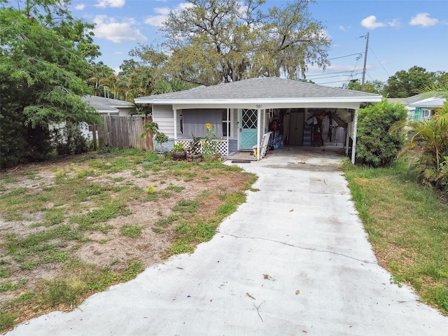 361 Colonial Ct, Dunedin, FL 34698 - bungalow with driveway and a carport