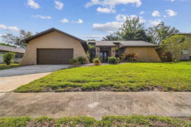 854 Village Way, Palm Harbor, FL 34683 - mid-century inspired home with an attached garage, a front lawn, french doors, driveway, and stucco siding