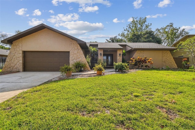854 Village Way, Palm Harbor, FL 34683 - mid-century home featuring french doors, a garage, a front lawn, driveway, and stucco siding