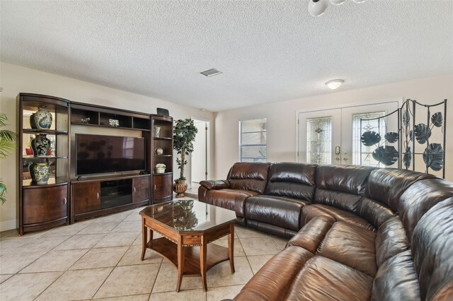 854 Village Way, Palm Harbor, FL 34683 - living area with a textured ceiling and light tile patterned flooring