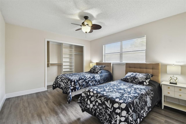 854 Village Way, Palm Harbor, FL 34683 - bedroom with a closet, wood finished floors, a textured ceiling, baseboards, and a ceiling fan