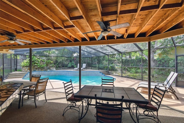 854 Village Way, Palm Harbor, FL 34683 - outdoor pool featuring ceiling fan, a patio, and glass enclosure