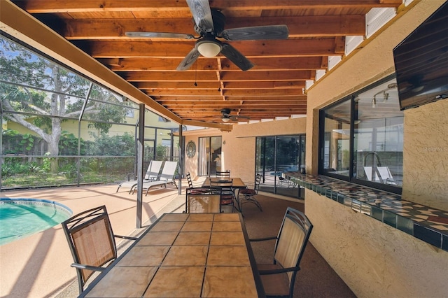 854 Village Way, Palm Harbor, FL 34683 - unfurnished sunroom with a ceiling fan, outdoor dining space, and beamed ceiling