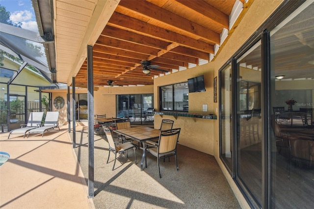 854 Village Way, Palm Harbor, FL 34683 - view of patio featuring a ceiling fan, glass enclosure, and outdoor dining space