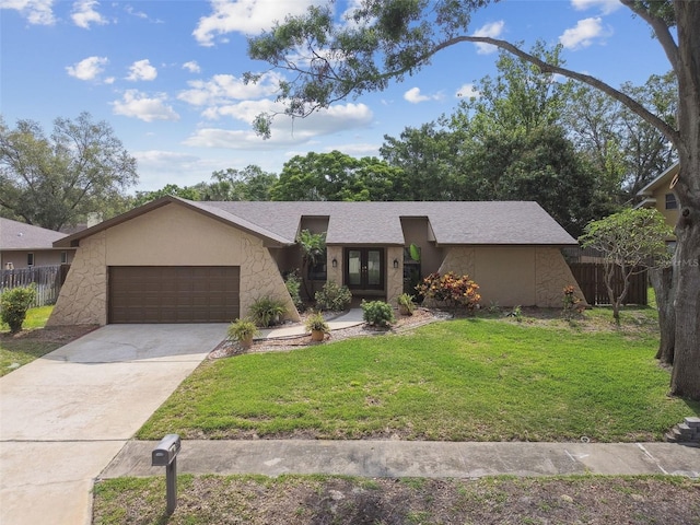 854 Village Way, Palm Harbor, FL 34683 - mid-century modern home featuring french doors, an attached garage, concrete driveway, and stucco siding