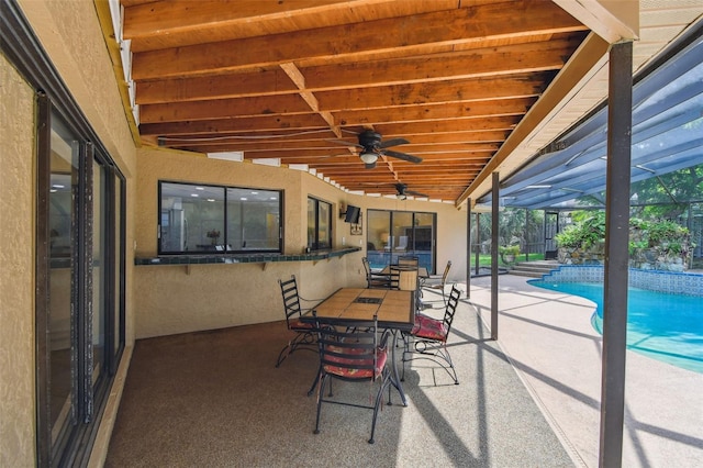 854 Village Way, Palm Harbor, FL 34683 - view of patio with a ceiling fan, an outdoor pool, outdoor dining area, and a lanai