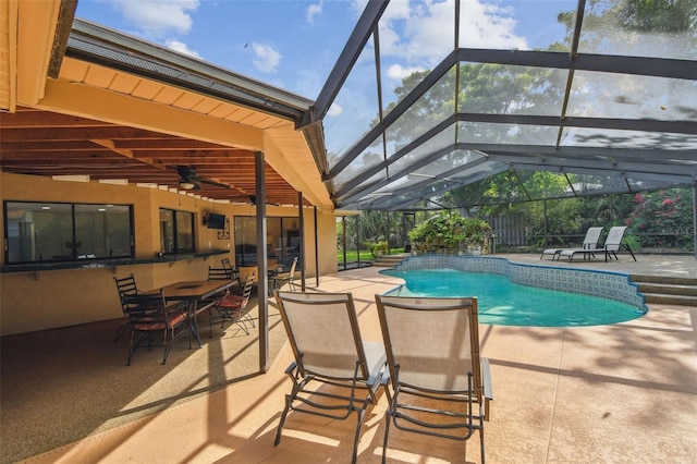 854 Village Way, Palm Harbor, FL 34683 - swimming pool featuring a patio, ceiling fan, a lanai, and outdoor dining space