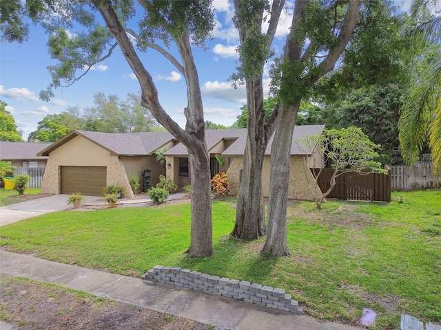 854 Village Way, Palm Harbor, FL 34683 - view of front of home with an attached garage, concrete driveway, and stucco siding