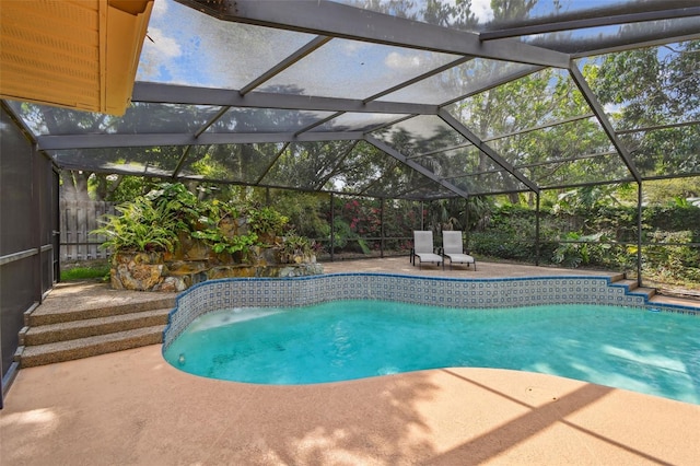 854 Village Way, Palm Harbor, FL 34683 - view of swimming pool featuring a patio area, a fenced backyard, and a lanai