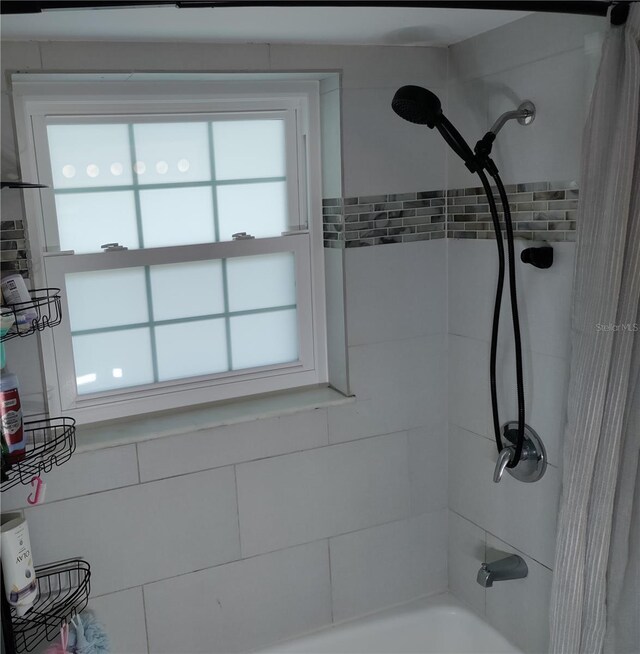 3850 13th Ave N Unit 311, Saint Petersburg, FL 33713 - full bath featuring shower / bath combo and healthy amount of natural light