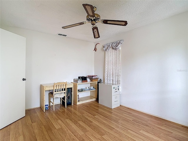 120 Colony S Dr, Tarpon Springs, FL 34689 - office with light wood finished floors, ceiling fan, and a textured ceiling