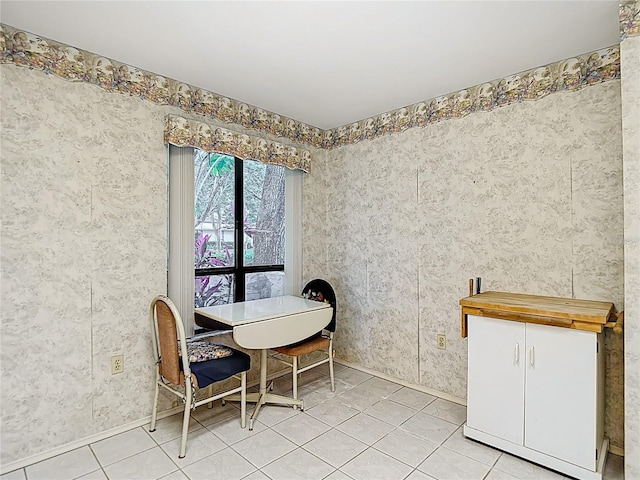 120 Colony S Dr, Tarpon Springs, FL 34689 - dining space with baseboards and light tile patterned floors