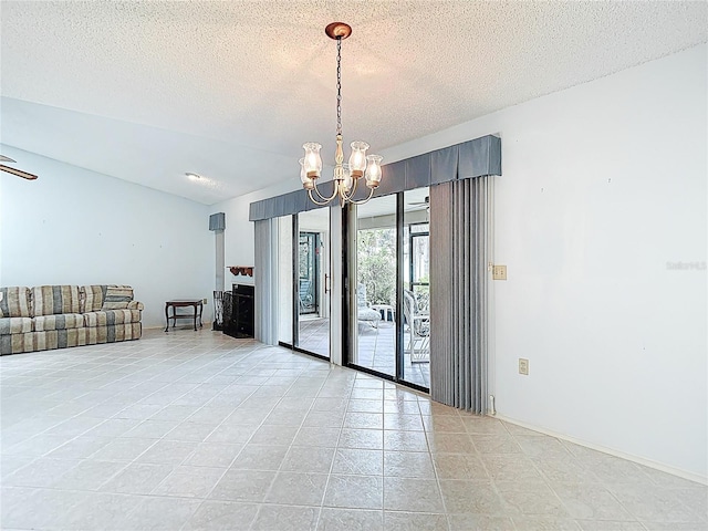 120 Colony S Dr, Tarpon Springs, FL 34689 - unfurnished room featuring a chandelier, a textured ceiling, and light tile patterned flooring