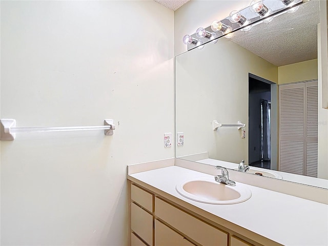 120 Colony S Dr, Tarpon Springs, FL 34689 - bathroom with a textured ceiling and vanity