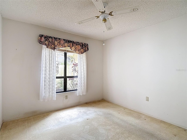 120 Colony S Dr, Tarpon Springs, FL 34689 - unfurnished room with a ceiling fan, carpet floors, and a textured ceiling