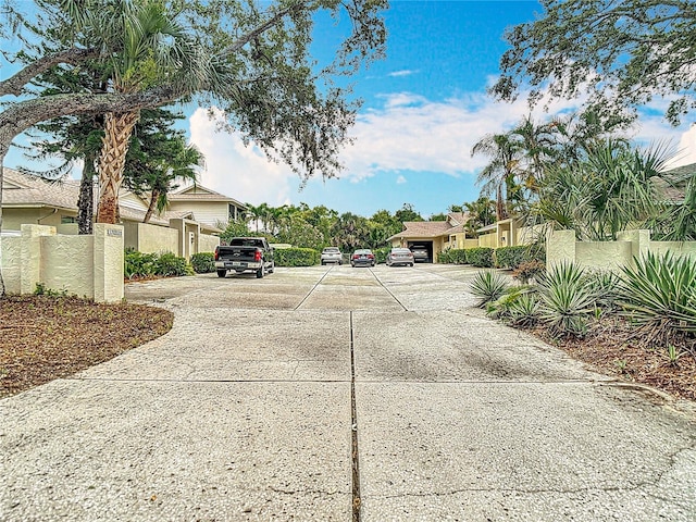 120 Colony S Dr, Tarpon Springs, FL 34689 - view of concrete driveway with a residential view