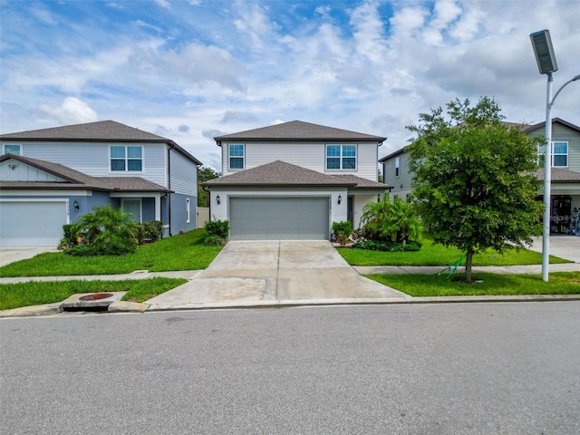 9324 Rally Spring Loop, Wesley Chapel, FL 33545 - traditional home featuring driveway, a front yard, and an attached garage