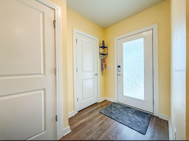 9324 Rally Spring Loop, Wesley Chapel, FL 33545 - doorway featuring wood finished floors and baseboards