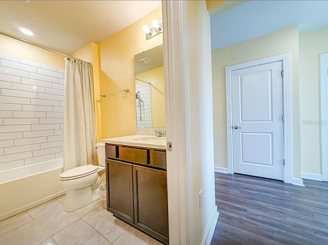 9324 Rally Spring Loop, Wesley Chapel, FL 33545 - full bathroom featuring vanity, toilet, shower / bath combo, and wood finished floors