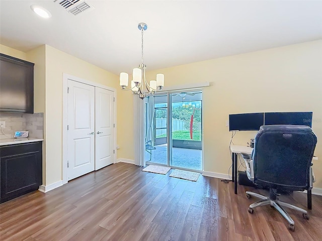 9324 Rally Spring Loop, Wesley Chapel, FL 33545 - office area with wood finished floors, a chandelier, and baseboards