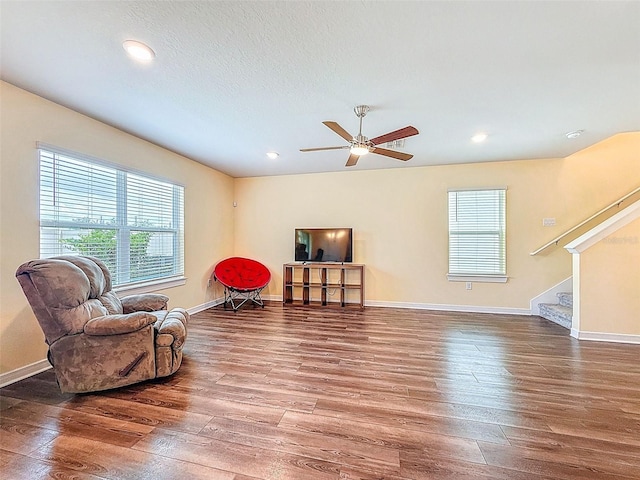 9324 Rally Spring Loop, Wesley Chapel, FL 33545 - sitting room with plenty of natural light, hardwood / wood-style flooring, ceiling fan, stairs, and recessed lighting